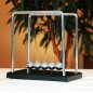 Newton's cradle pendulum balls - balance swinging magnetic metal balls