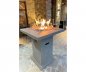 Bar table from concrete with an integrated gas fireplace(propane) for the exterior